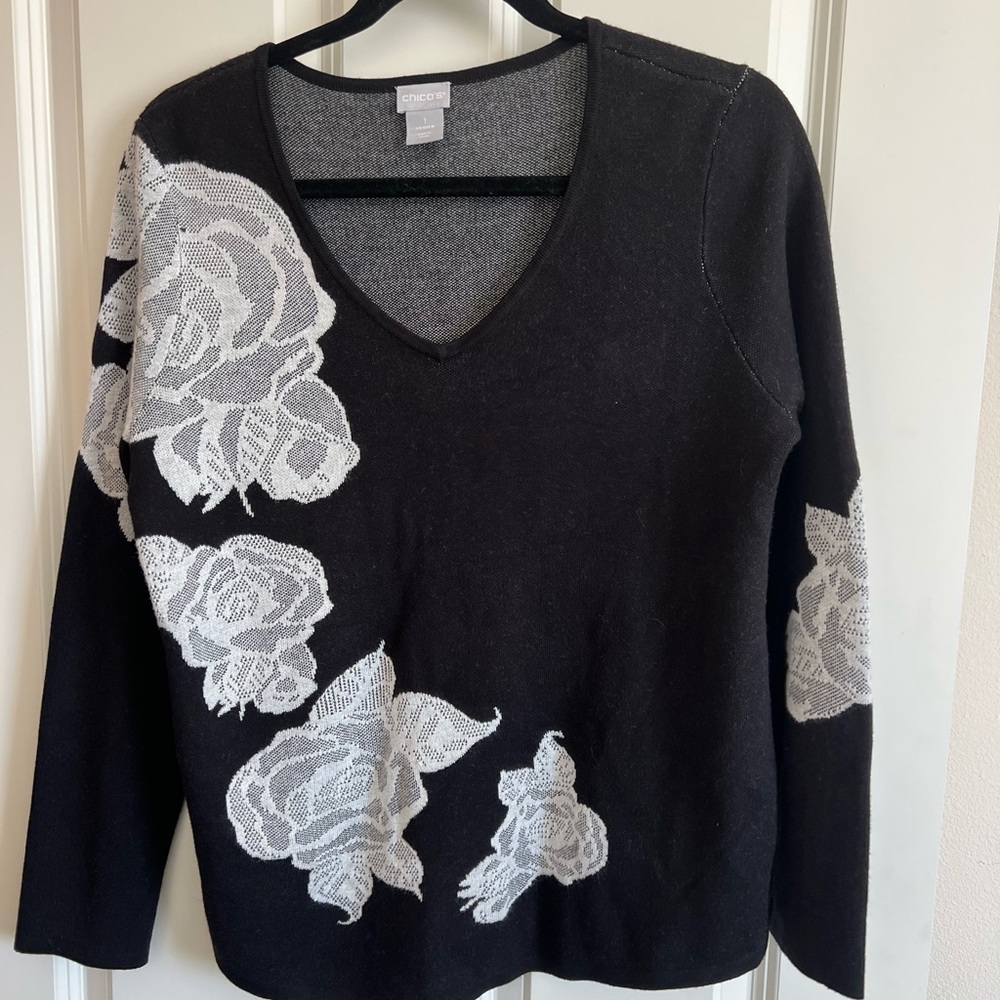 Chico’s black and white floral sweater.